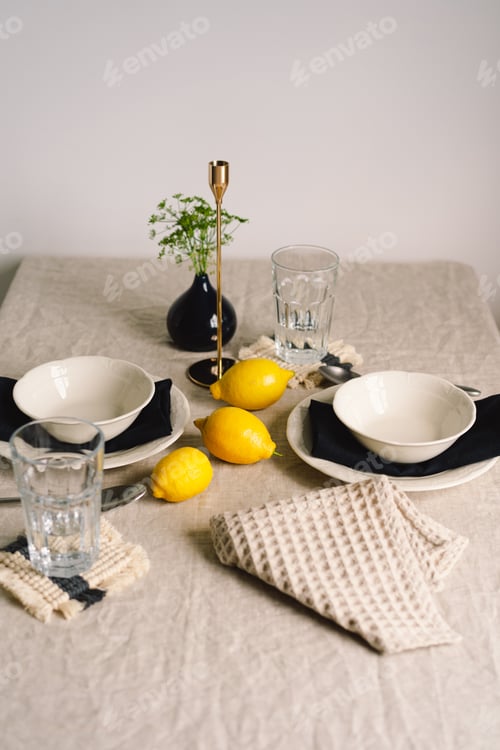 Preview: Vintage table setting with Linen napkins and yellow lemons.