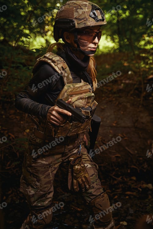 Preview: Female person aiming with weapon at target