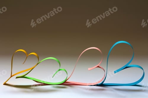 Preview: Valentine's day abstract background with cut paper colorful hearts on white.