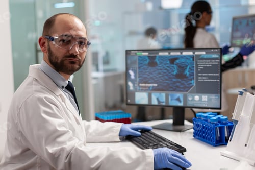 Preview: Portrait of scientist man looking at camera in modern laboratory