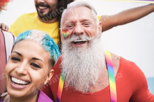 Preview: Group of friends taking a selfie outdoors at LGBT parade - Focus on senior man