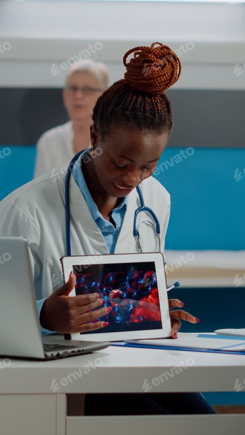 Preview: Black doctor holding virus animation on tablet