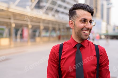 Preview: Young handsome Persian businessman exploring the city
