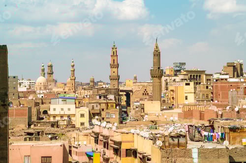Preview: Bustling cityscape under a clear blue sky