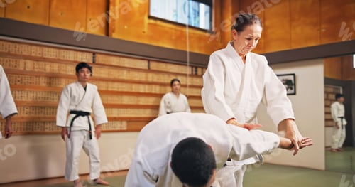 Preview: Karate demonstration, submission and teacher with students in dojo for fitness or training. Learnin