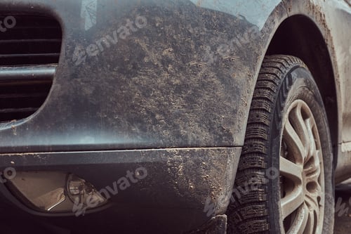 Preview: Close-up image of a dirty car after a trip around the countryside