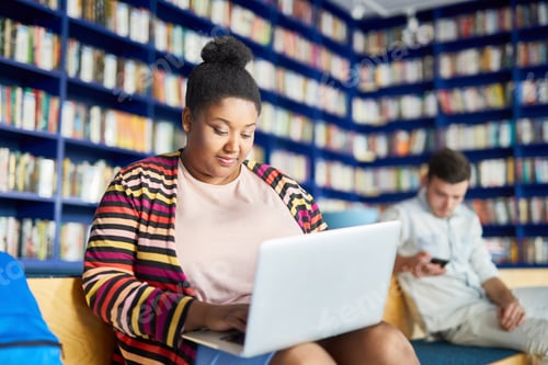 Preview: Portly African student girl using laptop