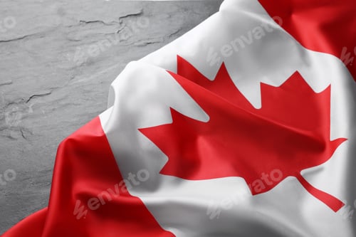 Preview: Flag of Canada on black table, closeup