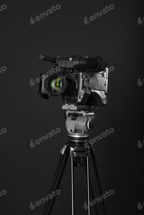 Preview: Modern professional video camera on black background