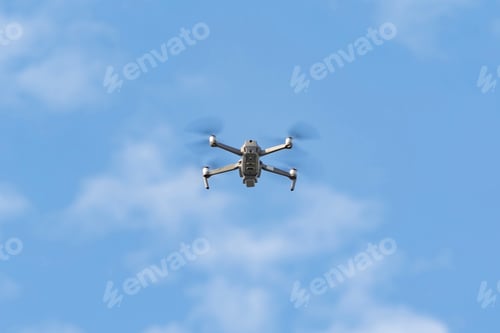 Preview: Aerial view of a drone with propellers flying with camera