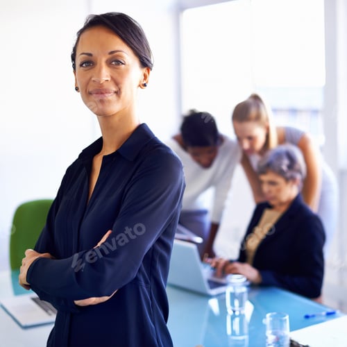 Preview: Portrait of a businesswoman standing in front of her colleagues during a meeting