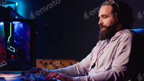 Preview: Man enjoying competitive online FPS videogame, battling flying robots with his friends