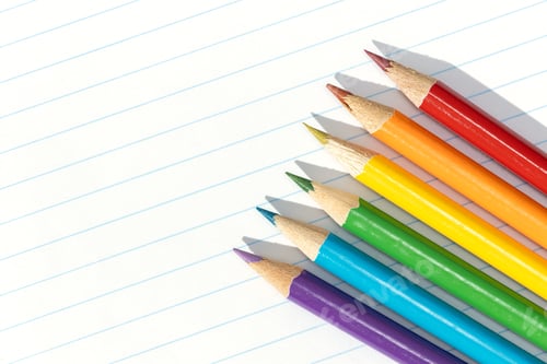 Preview: Colored pencils arranged in a formation resembling the pride flag. Copy space
