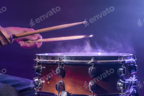 Preview: The drummer plays the drums.