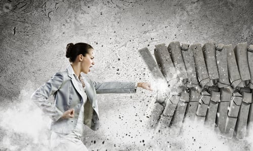 Preview: Image Of Businesswoman Breaking Bricks With Hand
