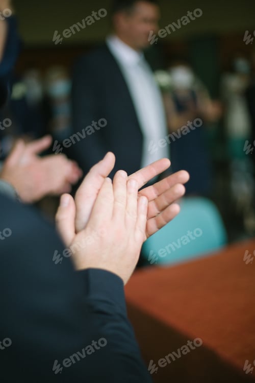 Preview: Man hands clapping in a blurry background