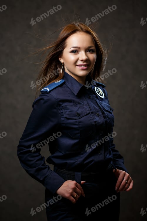 Preview: portrait of a beautiful girl in police uniform. Professional posing