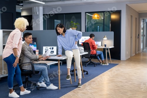 Preview: In modern office, diverse young team discussing work