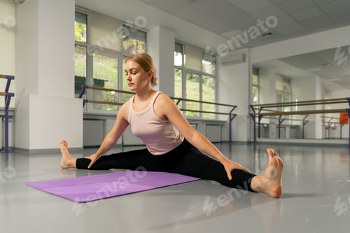 Preview: in the studio of spiritual development master class on yoga a young girl in a bright room on purple