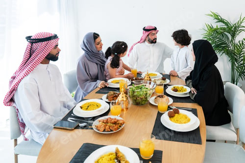 Preview: Happy arab family wearing saudi arabia clothing at home