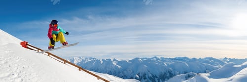 Preview: Snowboarder Jumping Downhill Wide Banner