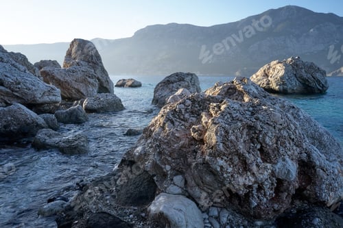 Preview: Peaked rocks on seashore.