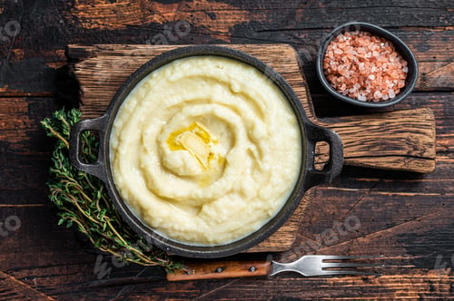 Preview: Mashed potatoes in a pan on wooden rustic table. Wooden background. Top view