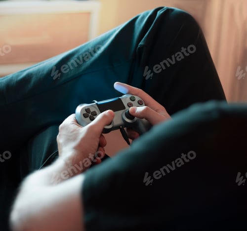 Preview: Man playing video games with joystick