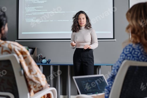Preview: Businesswoman Standing in Front of Her Coworkers and Giving Speech