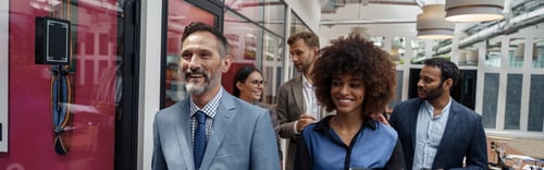 Preview: Group of multiethnic business people crossing office together
