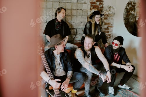 Preview: Cheerful Musicians Sitting On Leather Couch