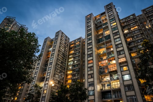 Preview: Evening glow from residential windows in urban Hong Kong buildings