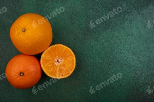 Preview: top view copy space orange with grapefruit and tangerine on green background