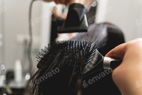 Preview: Focused photo on hairdryer that being in hand