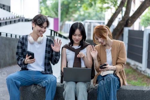 Preview: Three young people are sitting on a bench, each with a cell phone in their hands