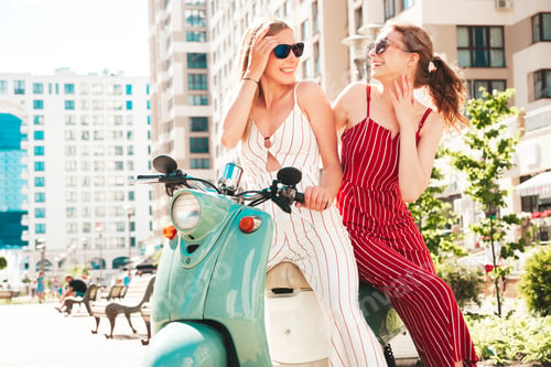 Preview: Two young beautiful woman posing outdoors