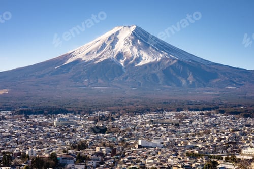 Preview: view of Mount Fuji with snowy peak and a clear blue sky overlooking Fujikawaguchiko in Japan