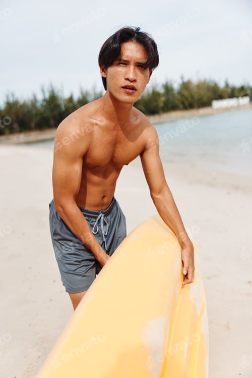 Preview: Asian Man Kayaking in Tropical Beach Paradise, Enjoying Active Vacation with Oar and Paddle.