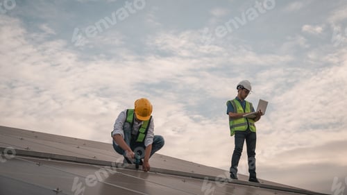 Preview: Service engineer checking solar cell on the roof for maintenance if there is a damaged part.