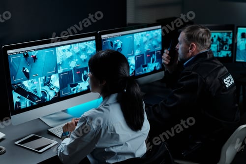 Preview: Officers in front of computer monitors