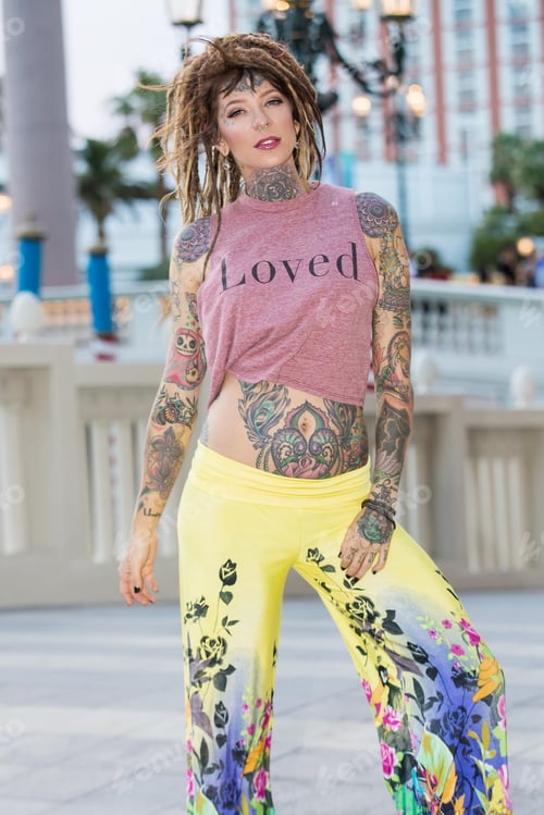 Preview: Beautiful hippie girl with tattoos and dreadlocks