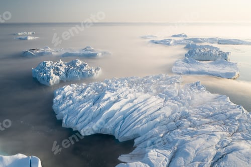 Preview: Aerial view of large glacier and iceberg