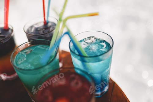 Preview: Exotic summer drinks cocktails served. Blur beach as background