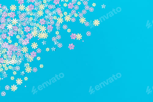 Preview: Confetti flowers on background with place for text