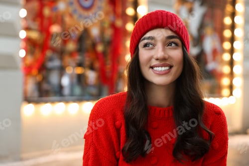 Preview: Portrait of smiling woman on blurred background, space for text. Winter time
