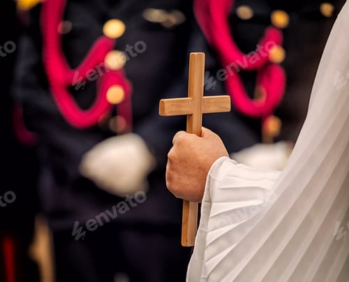 Preview: Angel holds a wooden crucifix during the celebration of Good Friday in a procession.