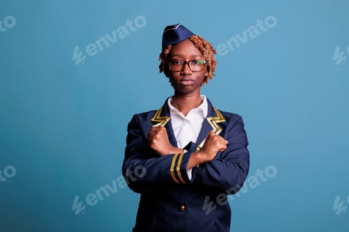 Preview: Flight attendant making a stop gesture with crossed arms