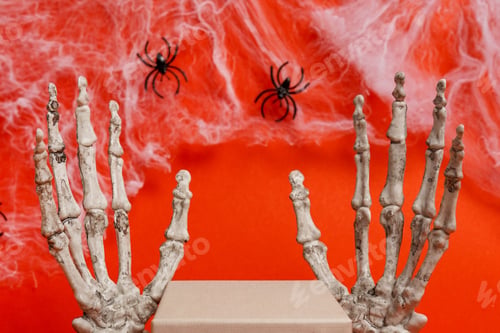 Preview: Halloween empty Podium for products display over red background. skeleton hands and spiders