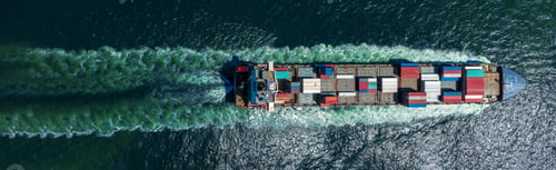Preview: Aerial top view of cargo ship with contrail in the ocean sea ship carrying container and