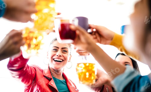 Preview: Women drinking and toasting beer at brewery bar restaurant